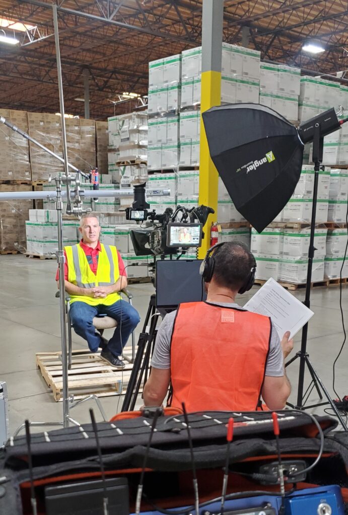 Filming interview in warehouse